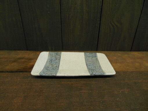 Rectangular Speckled Tray with Symbols Laced by Nellie Ralat side