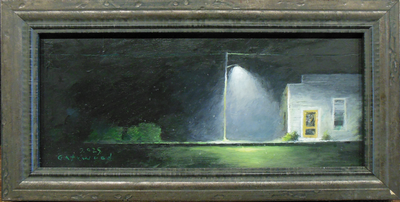white store on the right at night with light pole by Charles Gatewood